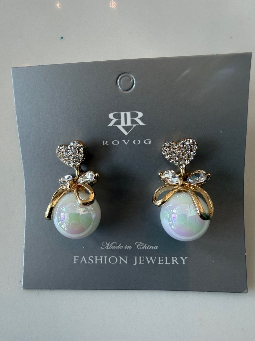 OVO Gold Bow & Iridescent Pearl Drop Earrings with Crystal Hearts